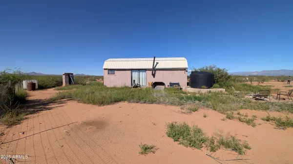 a kitchen with a refrigerator and cabinets