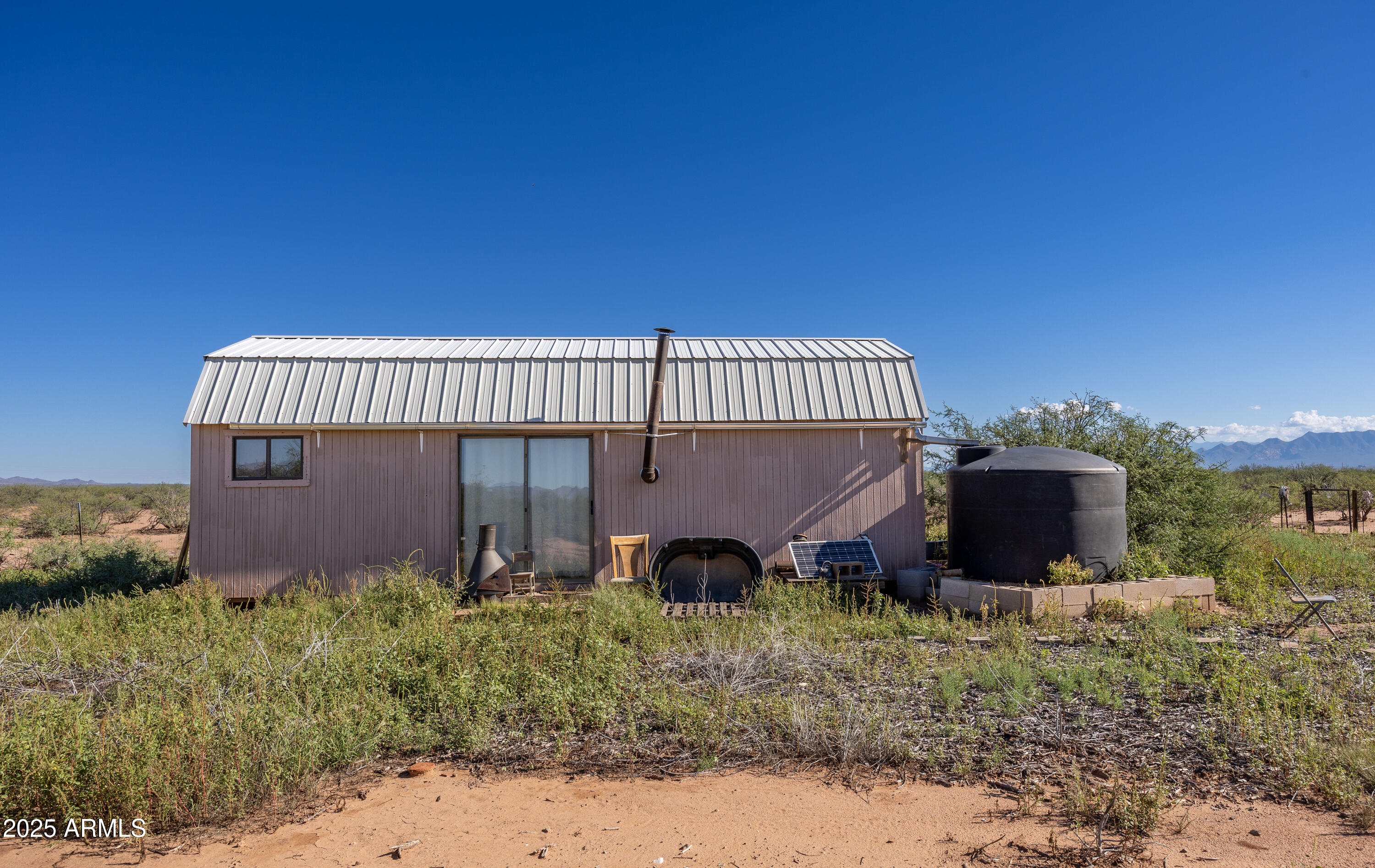 Tbd North Westward Trail, Unit 9 McNeal, AZ 85617 - Photo 26 of 37 a view of a house with a yard and sitting area