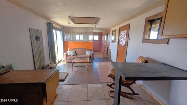 a bedroom with a bed and a mirror