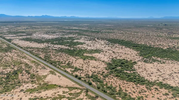 a view of an ocean and a yard