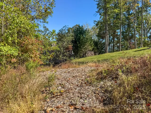 a view of a swimming pool with an outdoor space and seating area