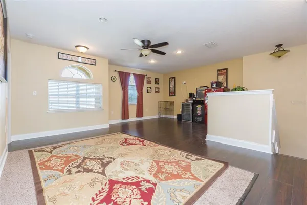a view of a livingroom with furniture window and wooden floor