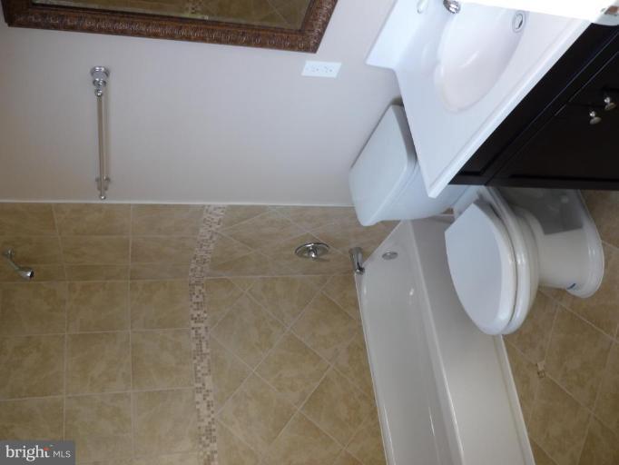 5224 Inverchapel Road Springfield, VA 22151 - Photo 11 of 30 a bathroom with a sink and a mirror