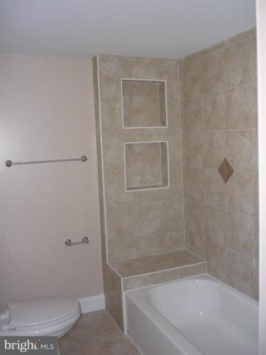 5224 Inverchapel Road Springfield, VA 22151 - Photo 21 of 30 a bath room with a toilet and a bath tub