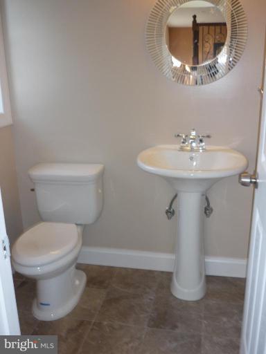 5224 Inverchapel Road Springfield, VA 22151 - Photo 24 of 30 a bathroom with a sink toilet and a mirror