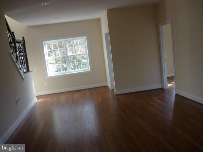 5224 Inverchapel Road Springfield, VA 22151 - Photo 26 of 30 an empty room with wooden floor and windows