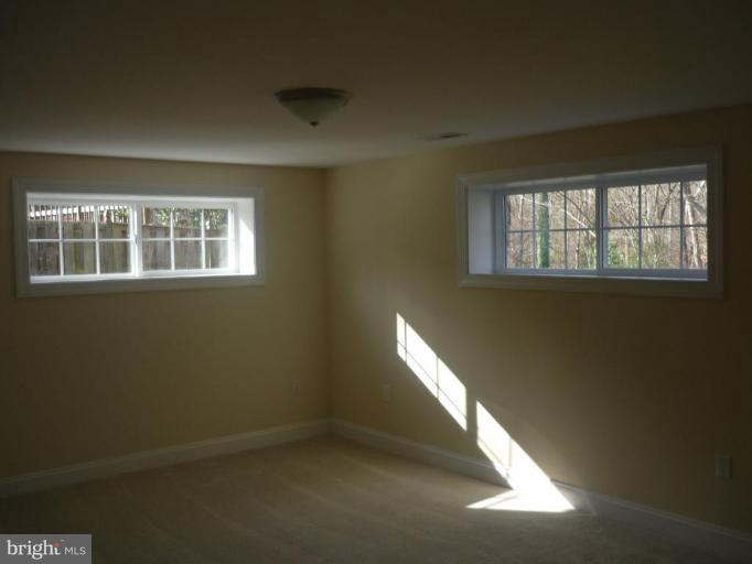 5224 Inverchapel Road Springfield, VA 22151 - Photo 27 of 30 a view of an empty room with a window