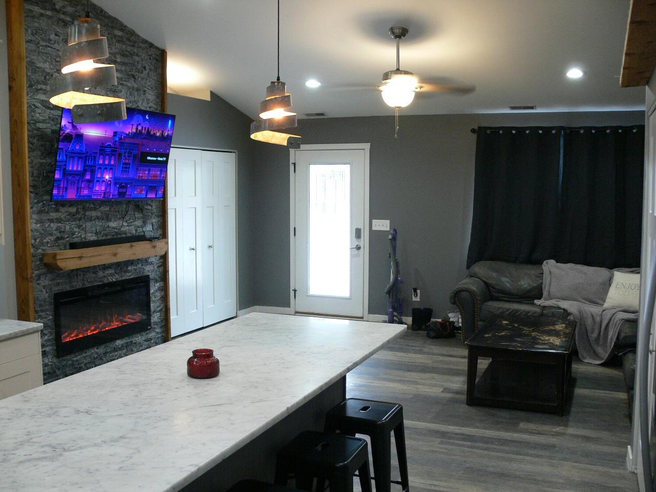 4223 Ostrander Road Rockford, IL 61107 - Photo 15 of 20 a living room with furniture and a fireplace