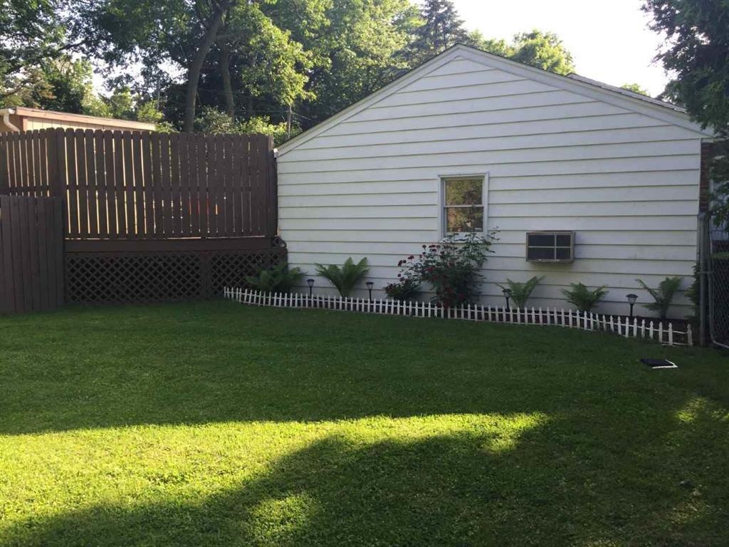4223 Ostrander Road Rockford, IL 61107 - Photo 4 of 20 a front view of a house having garden