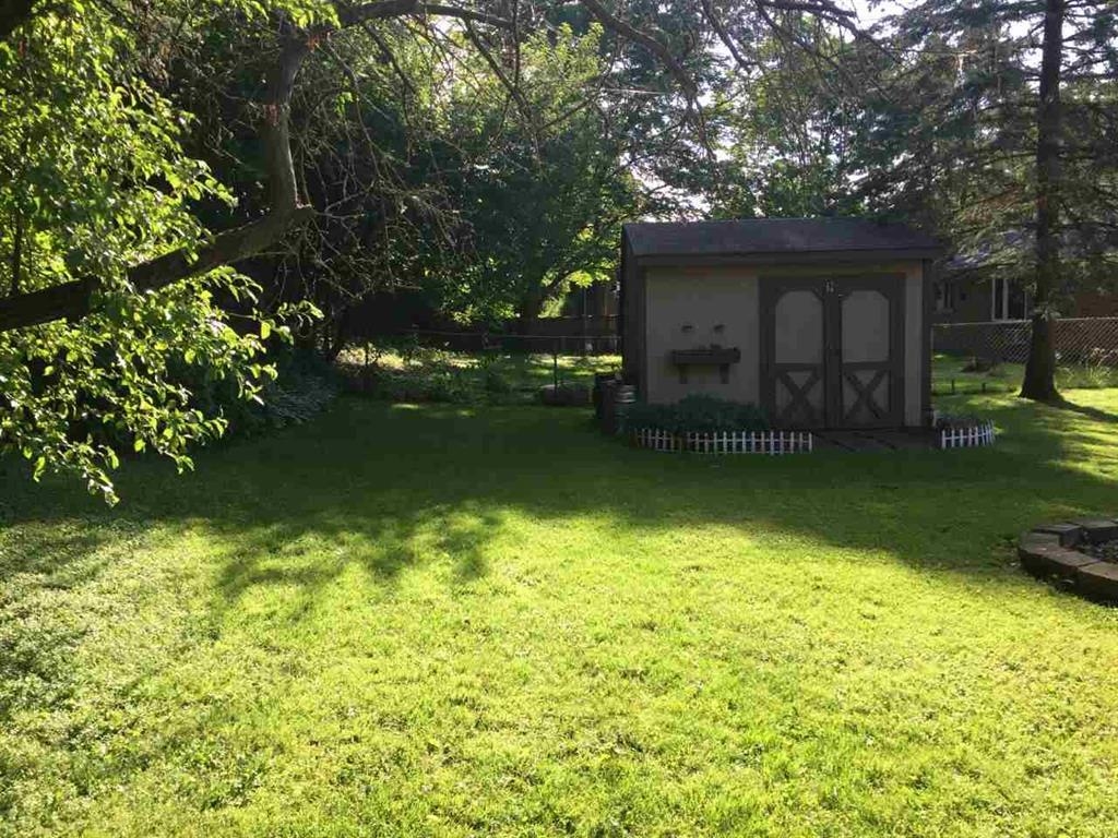 4223 Ostrander Road Rockford, IL 61107 - Photo 5 of 20 a view of a house with a garden