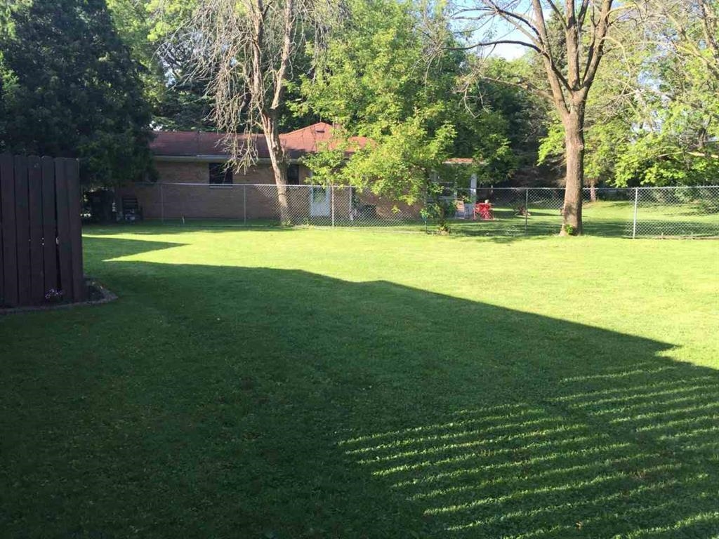 4223 Ostrander Road Rockford, IL 61107 - Photo 6 of 20 a view of a house with a backyard
