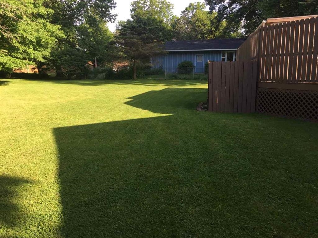 4223 Ostrander Road Rockford, IL 61107 - Photo 7 of 20 a view of a house with a yard