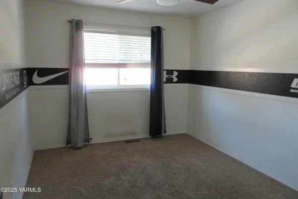 a view of an empty room and window