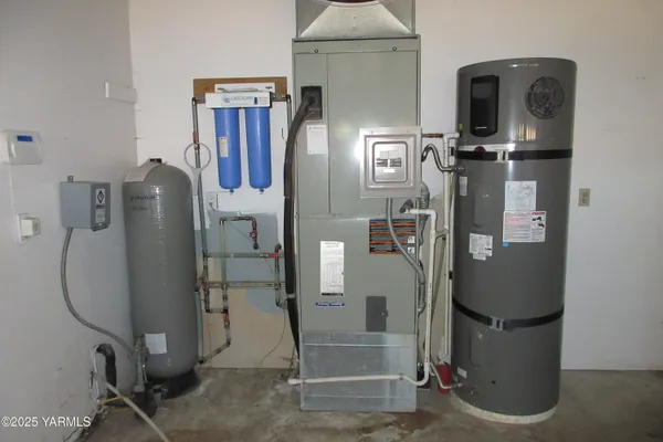 a room with water heater and storage