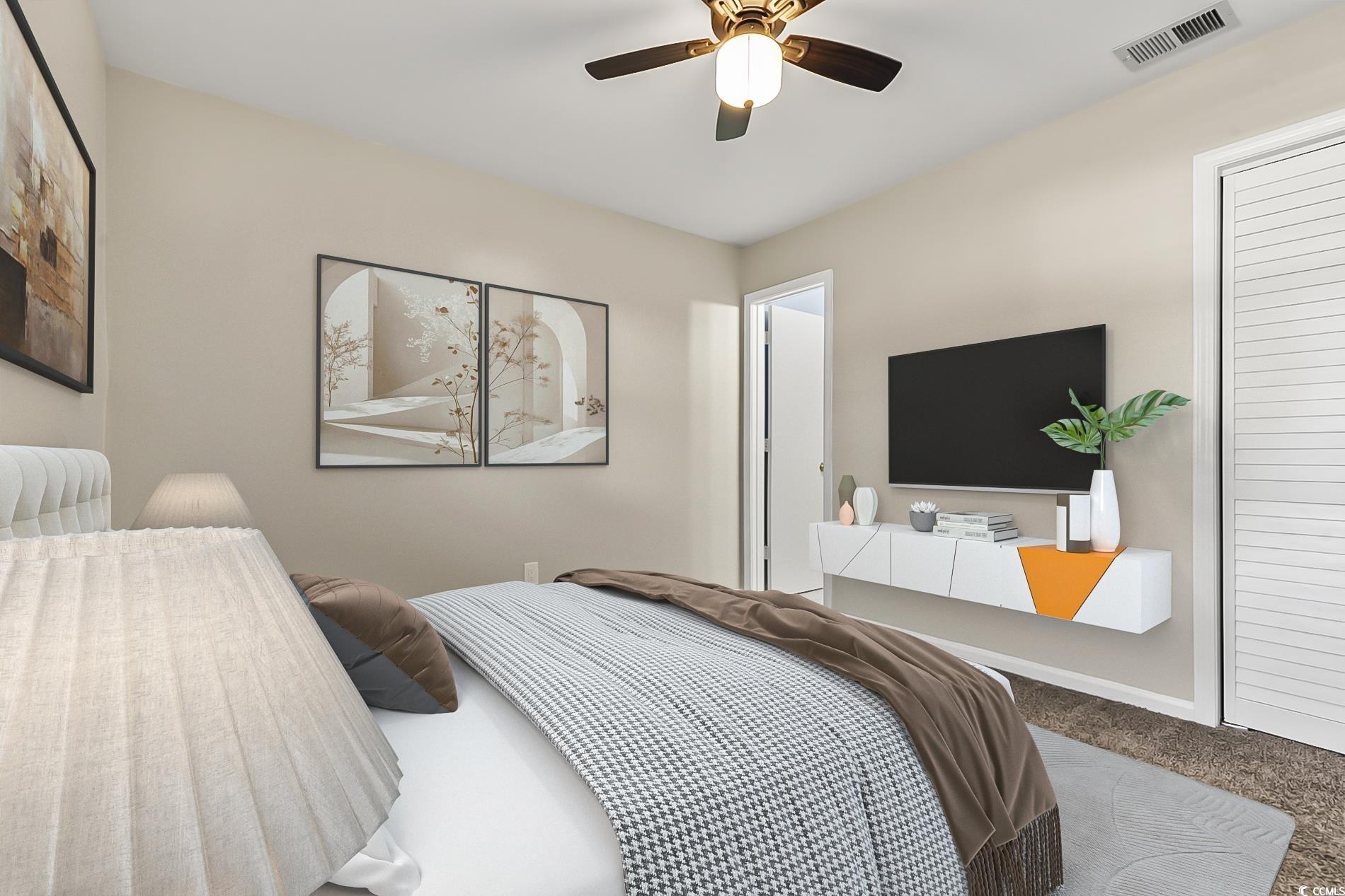 4150 Horseshoe Road North, Unit 38 Little River, SC 29566 - Photo 19 of 29 Carpeted bedroom with ceiling fan