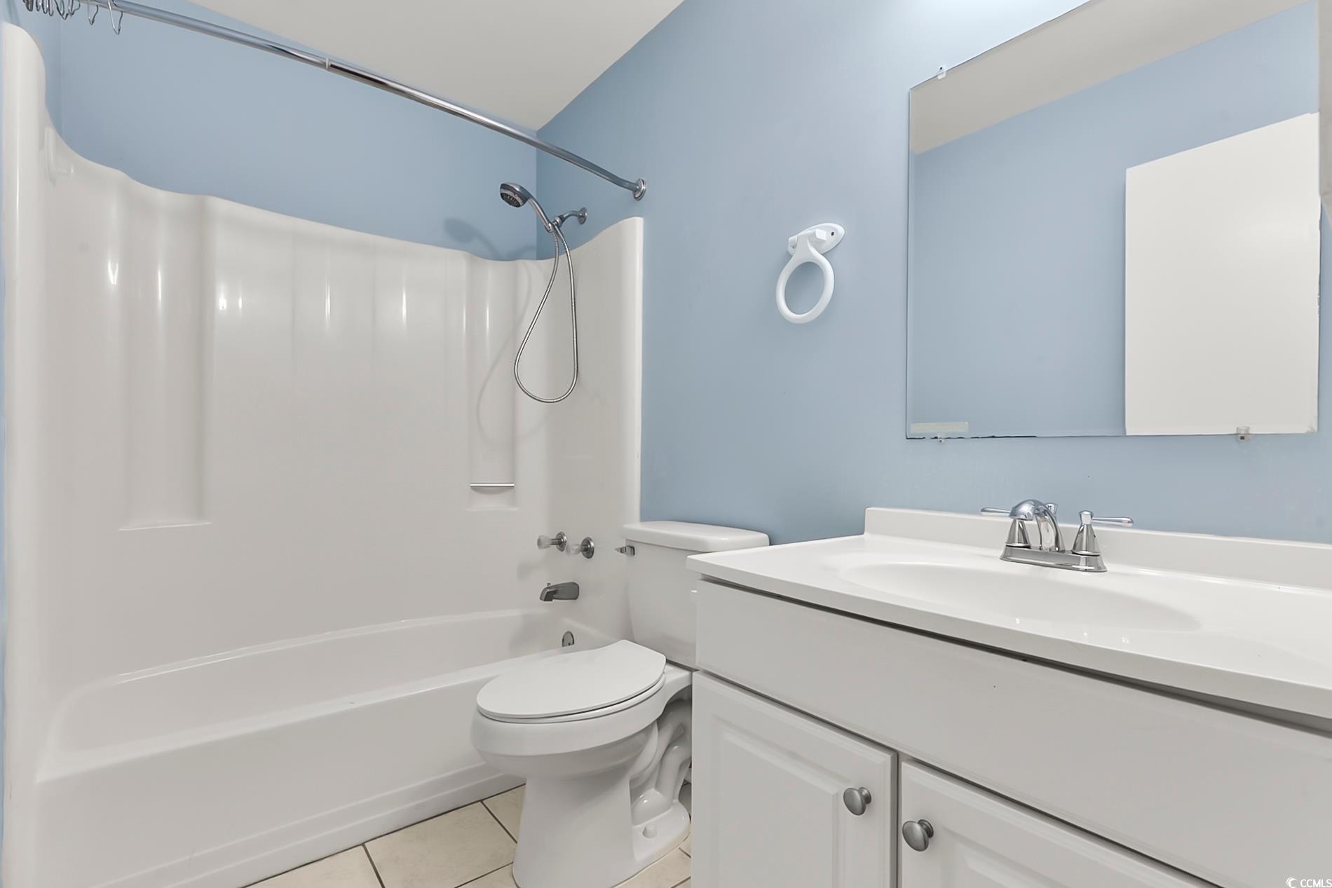 4150 Horseshoe Road North, Unit 38 Little River, SC 29566 - Photo 20 of 29 Bathroom featuring shower / tub combination, vanity, and light tile patterned flooring