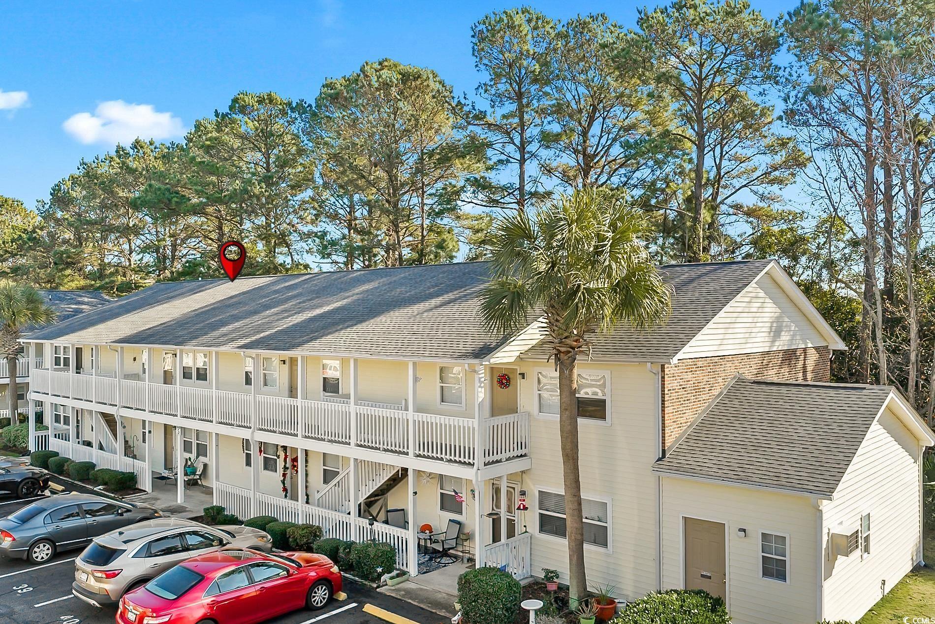 4150 Horseshoe Road North, Unit 38 Little River, SC 29566 - Photo 22 of 29 View of building exterior with uncovered parking