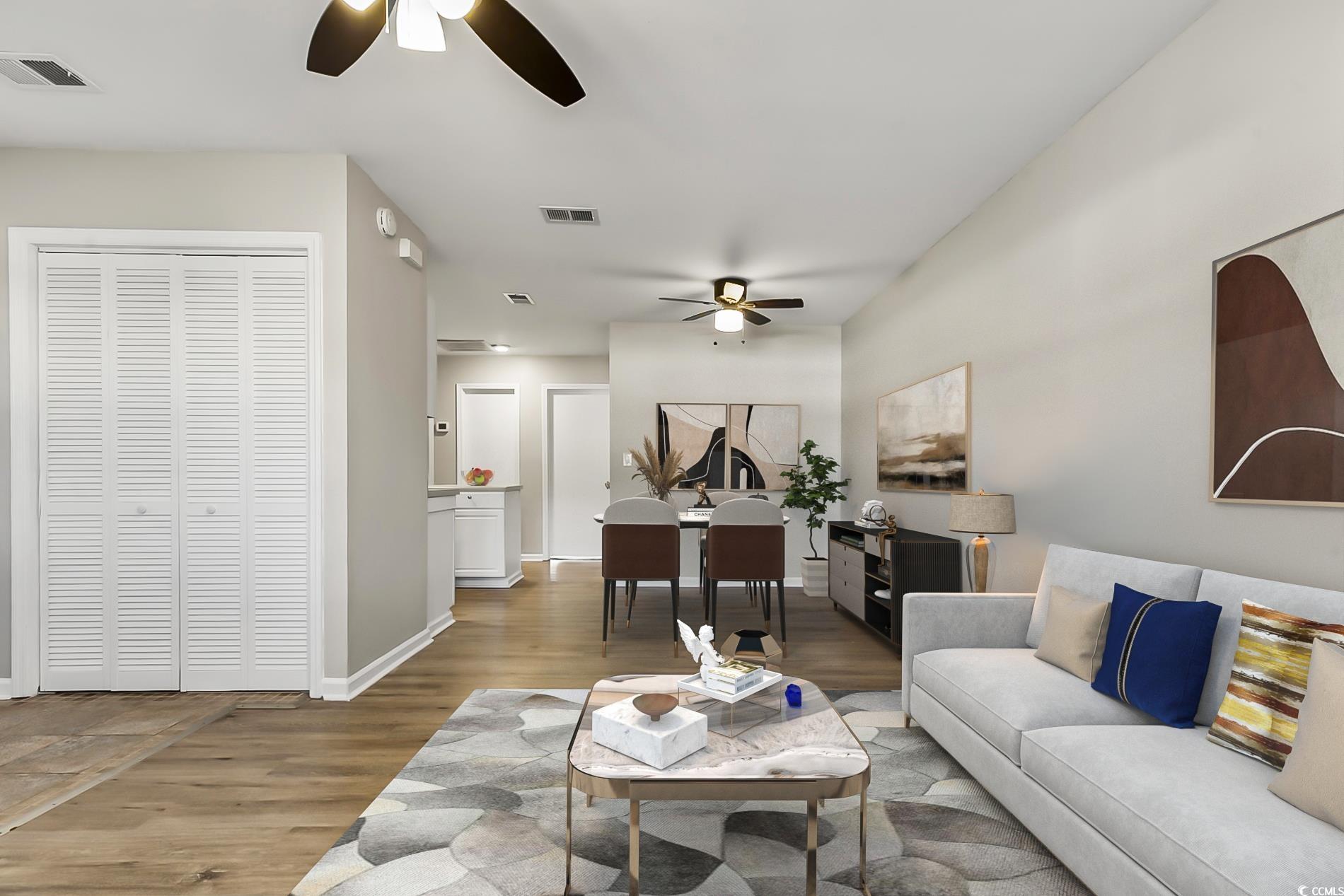 4150 Horseshoe Road North, Unit 38 Little River, SC 29566 - Photo 5 of 29 Living area featuring ceiling fan and light wood finished floors