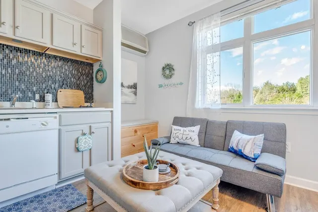 a living room with furniture and a table