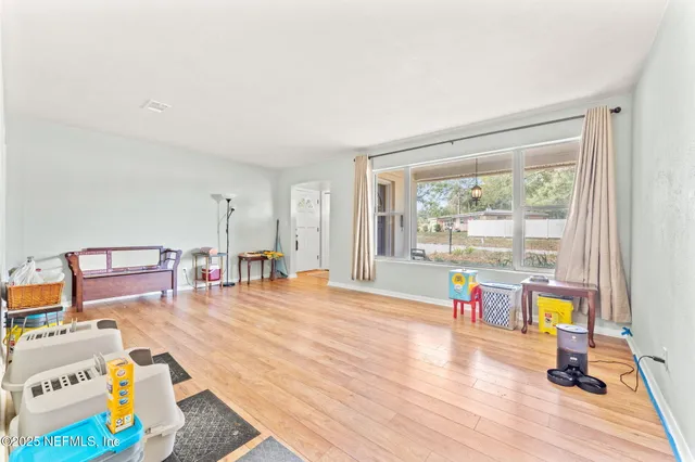 a living room filled with furniture and a table