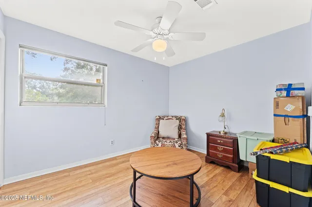 a room with furniture and wooden floor