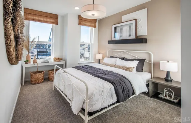 a bedroom with a bed and a night stand