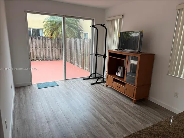 a bedroom with a bed and a mirror