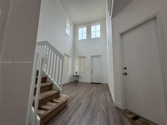 a bathroom with a sink toilet and mirror