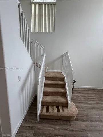 a utility room with a sink dryer and washer