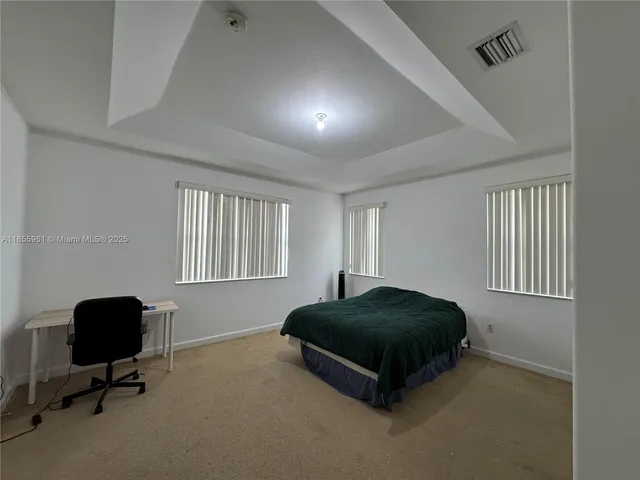 a room with furniture and gym equipment