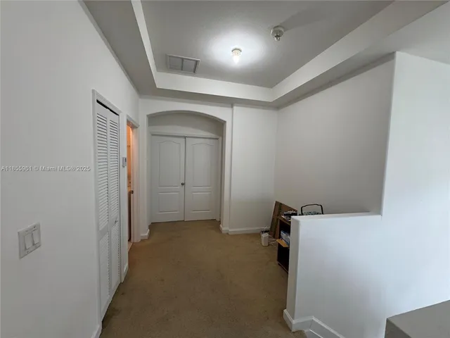 a view of backyard with wooden fence and deck