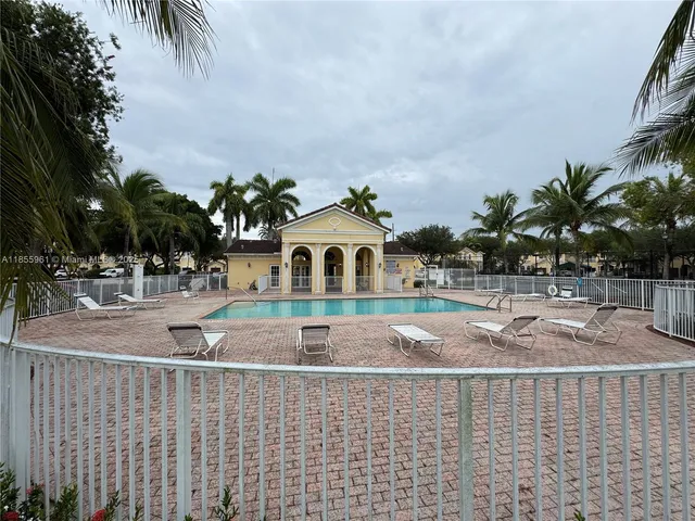 a view of a park with large trees