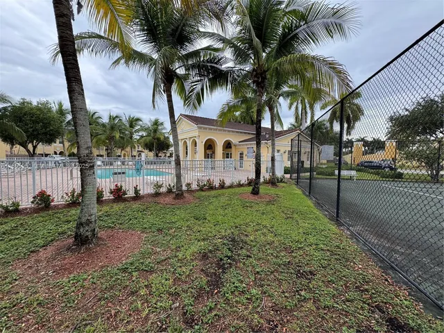 a view of swimming pool from a balcony