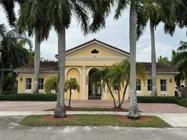a backyard of a house with wooden fence