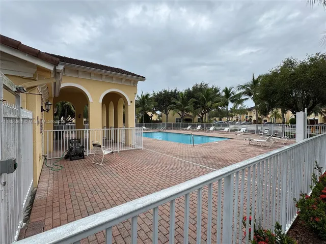 a view of a room with wooden floor and stairs