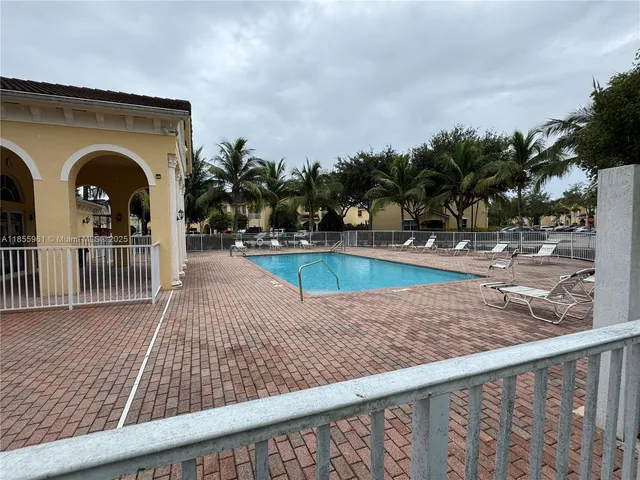 a view of a room with wooden floor and stairs