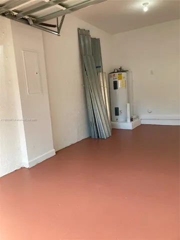 a bedroom with a bed and a chair