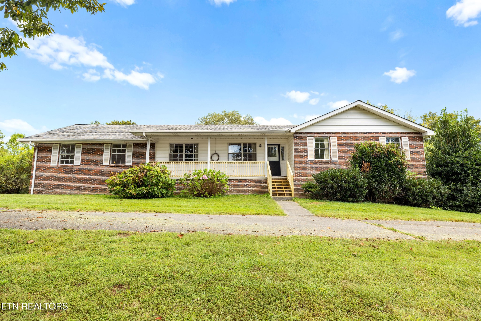 804 Chilhowee View Road Maryville, TN 37803 - Photo 1 of 38 a front view of a house with a yard and trees