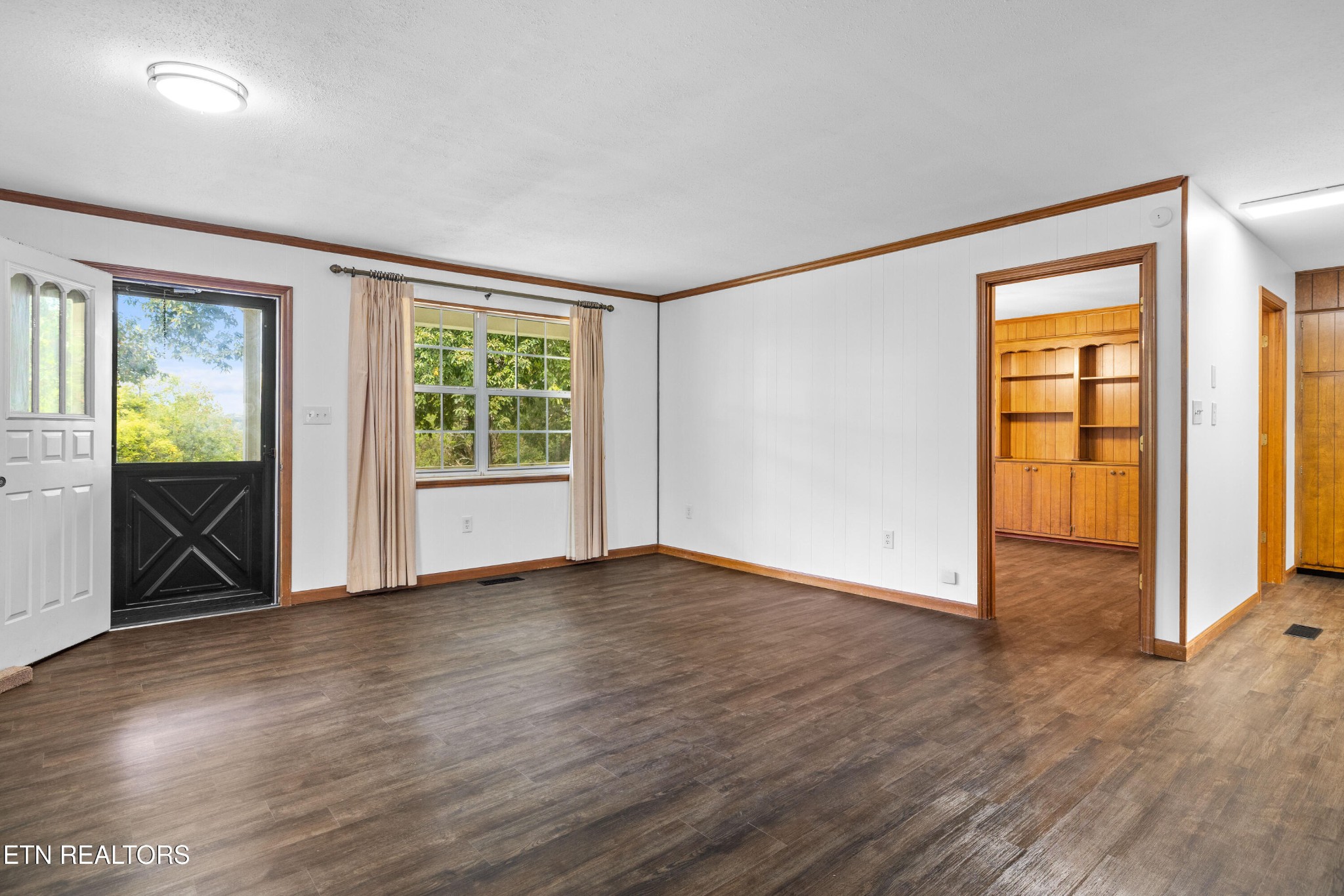 804 Chilhowee View Road Maryville, TN 37803 - Photo 20 of 38 an empty room with wooden floor and windows