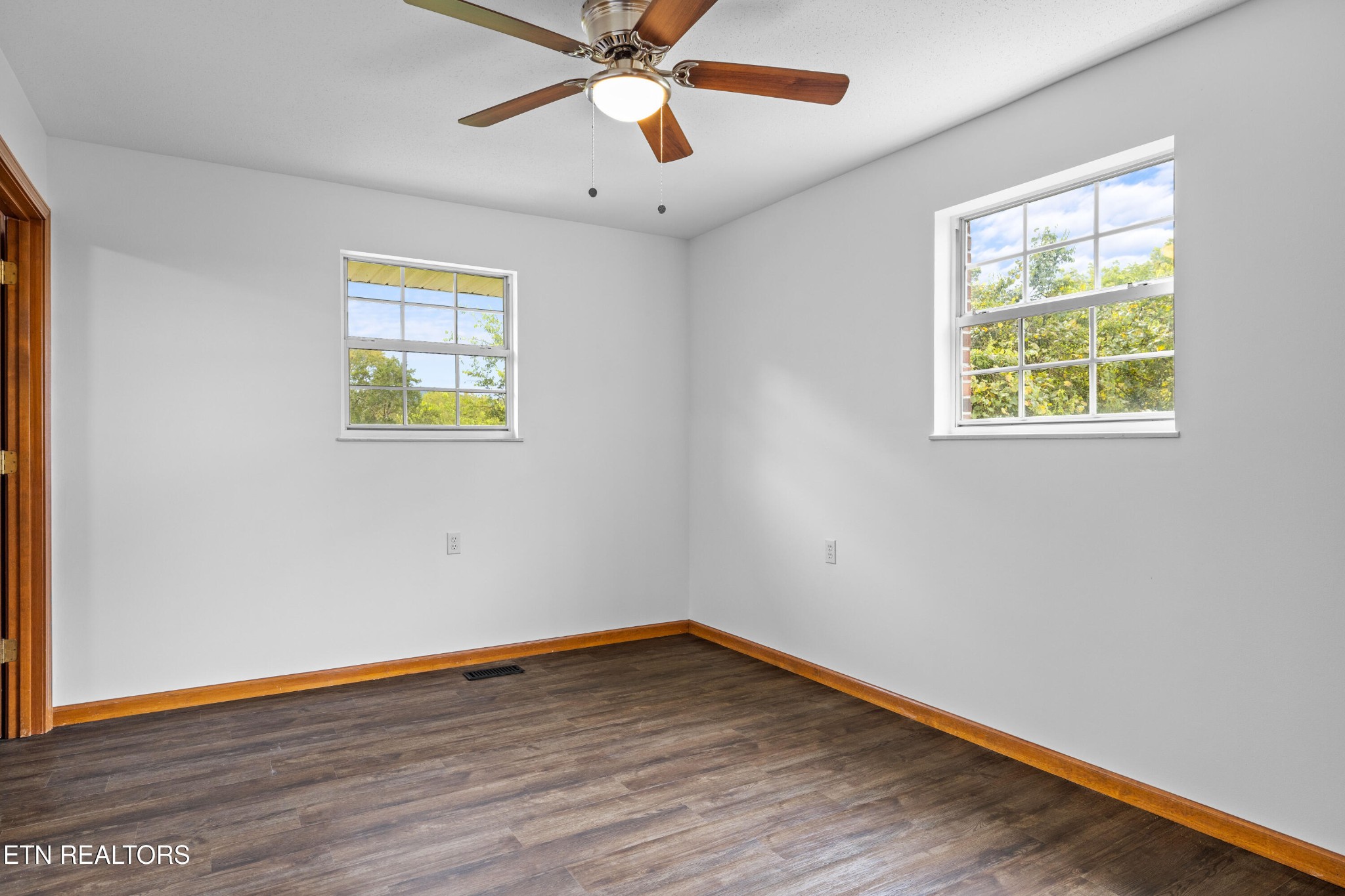 804 Chilhowee View Road Maryville, TN 37803 - Photo 23 of 38 a view of an empty room with wooden floor and a window
