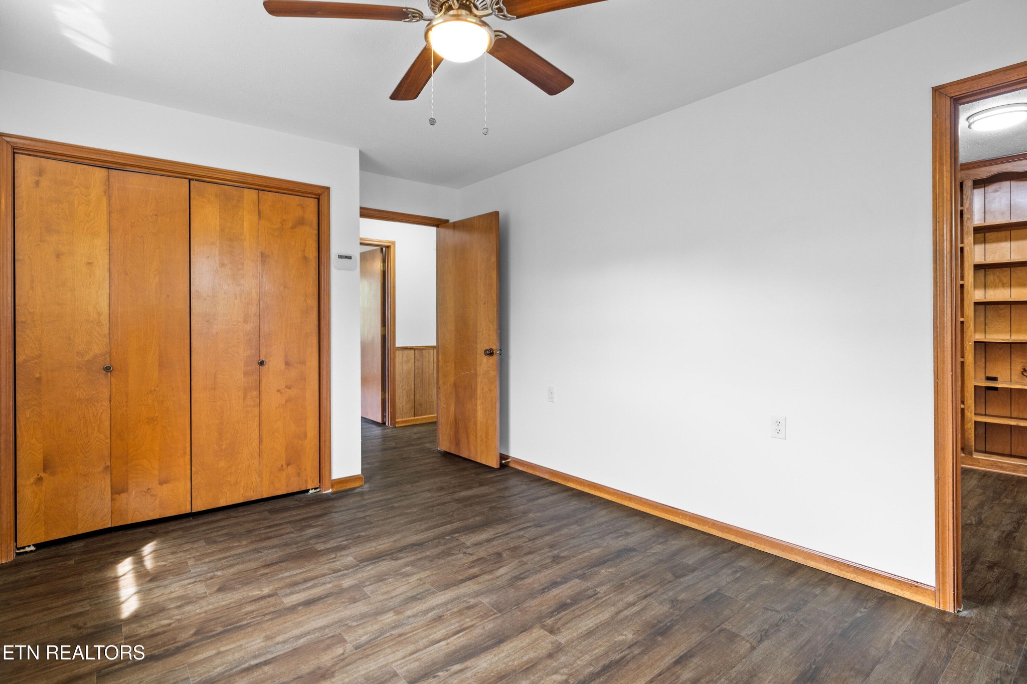 804 Chilhowee View Road Maryville, TN 37803 - Photo 24 of 38 a view of an empty room with wooden floor and a window