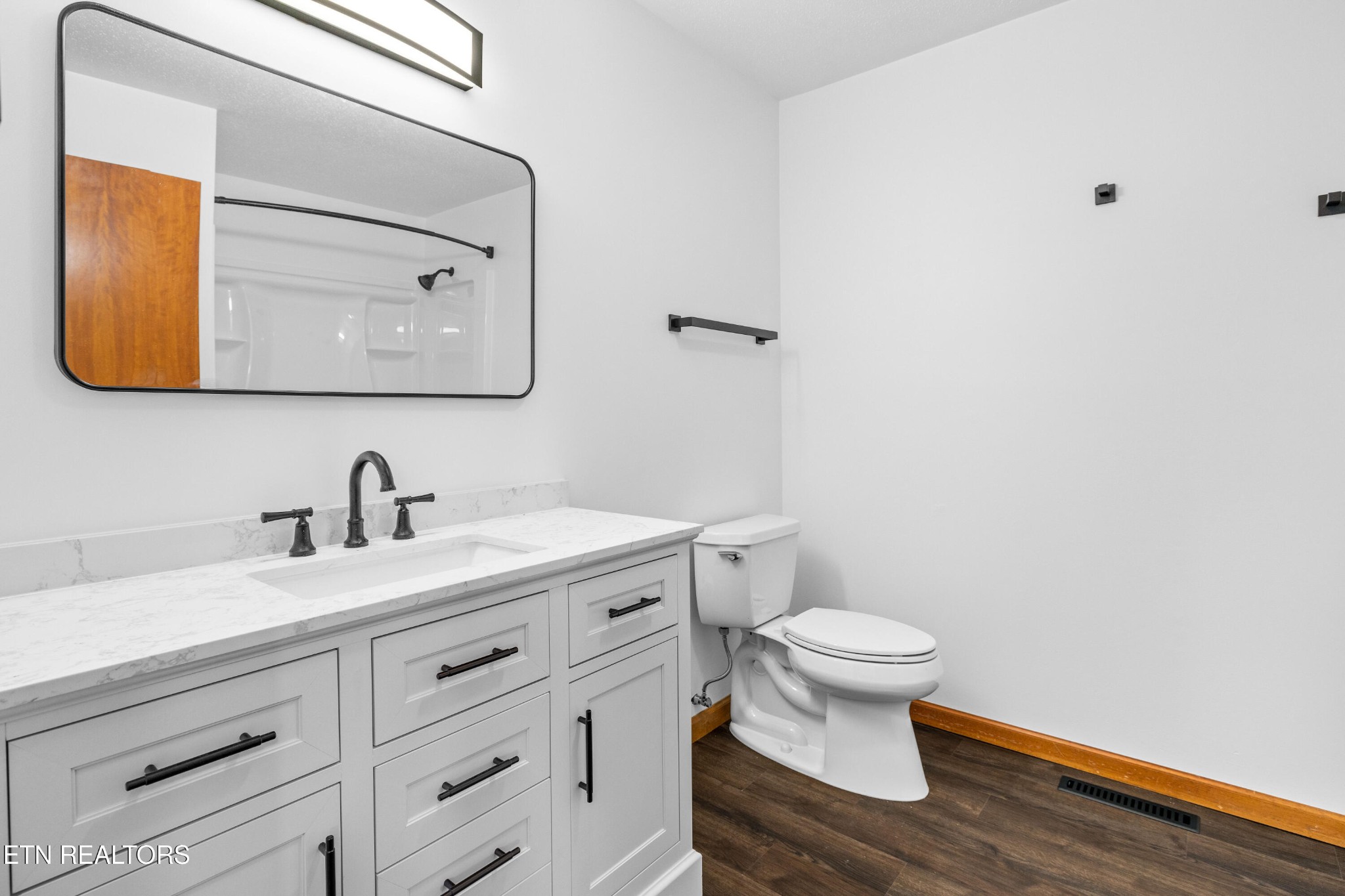 804 Chilhowee View Road Maryville, TN 37803 - Photo 26 of 38 a bathroom with a granite countertop toilet sink and mirror