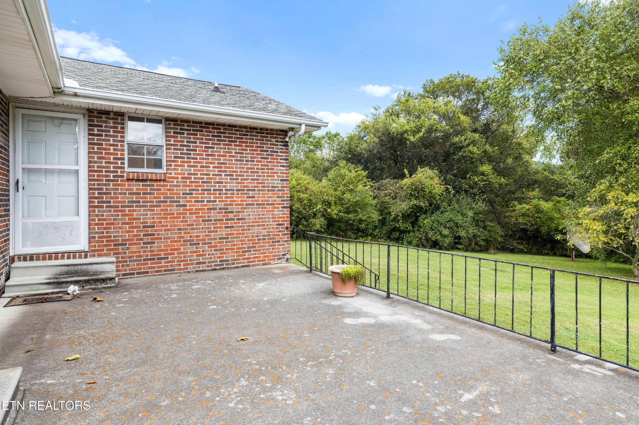 804 Chilhowee View Road Maryville, TN 37803 - Photo 30 of 38 a view of a backyard with brick wall