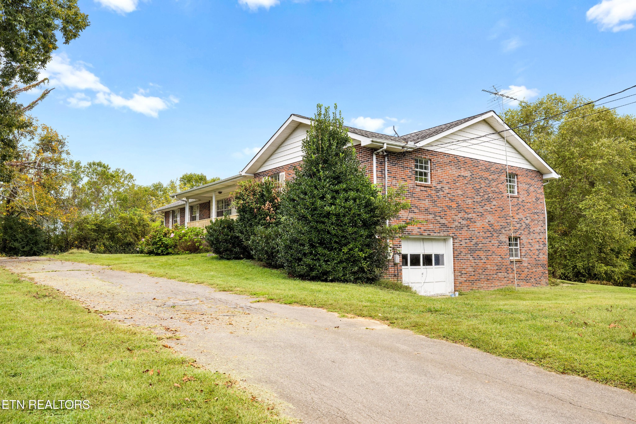 804 Chilhowee View Road Maryville, TN 37803 - Photo 34 of 38 a front view of a house with a yard and garage