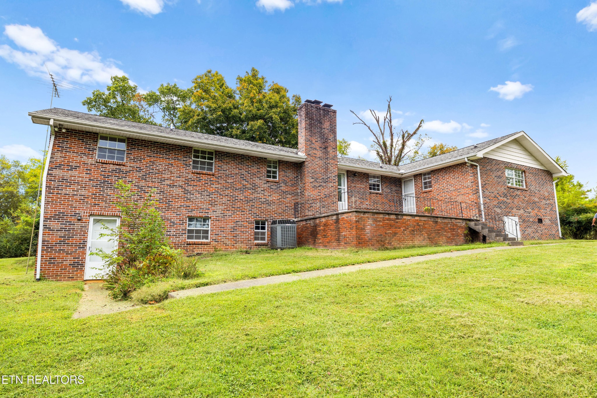 804 Chilhowee View Road Maryville, TN 37803 - Photo 36 of 38 a view of a house with a yard and potted plants