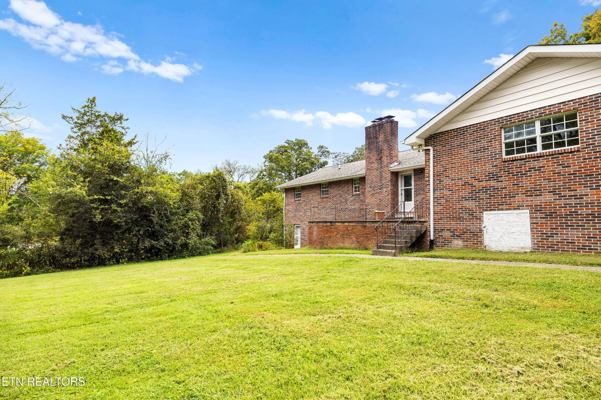 804 Chilhowee View Road Maryville, TN 37803 - Photo 38 of 38 a view of a house with a yard