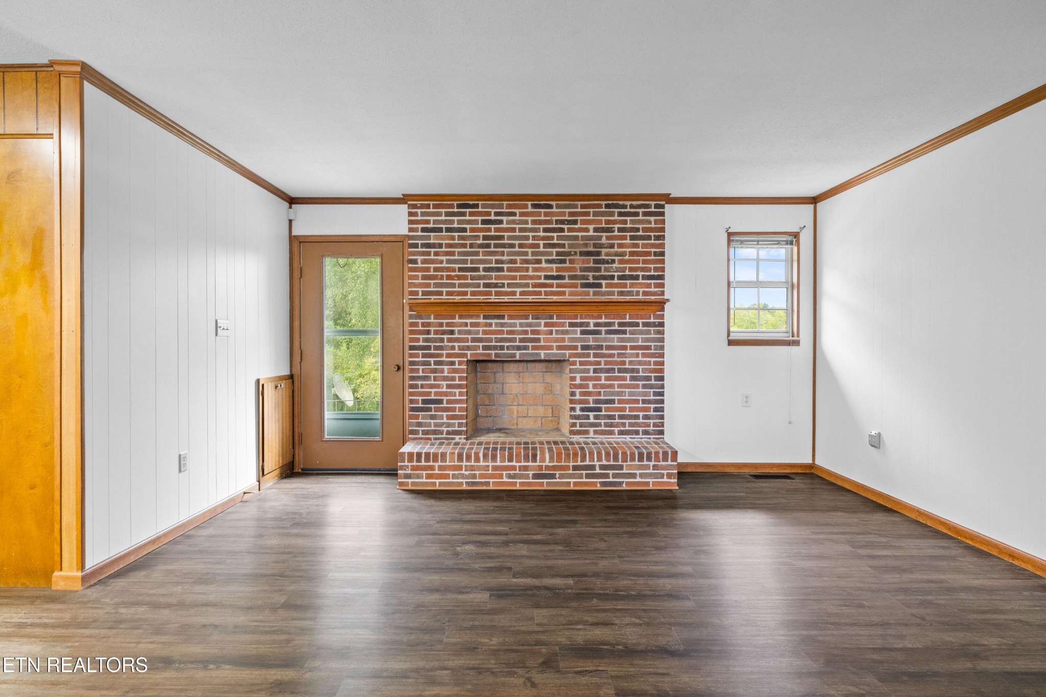 804 Chilhowee View Road Maryville, TN 37803 - Photo 6 of 38 an empty room with wooden floor and windows