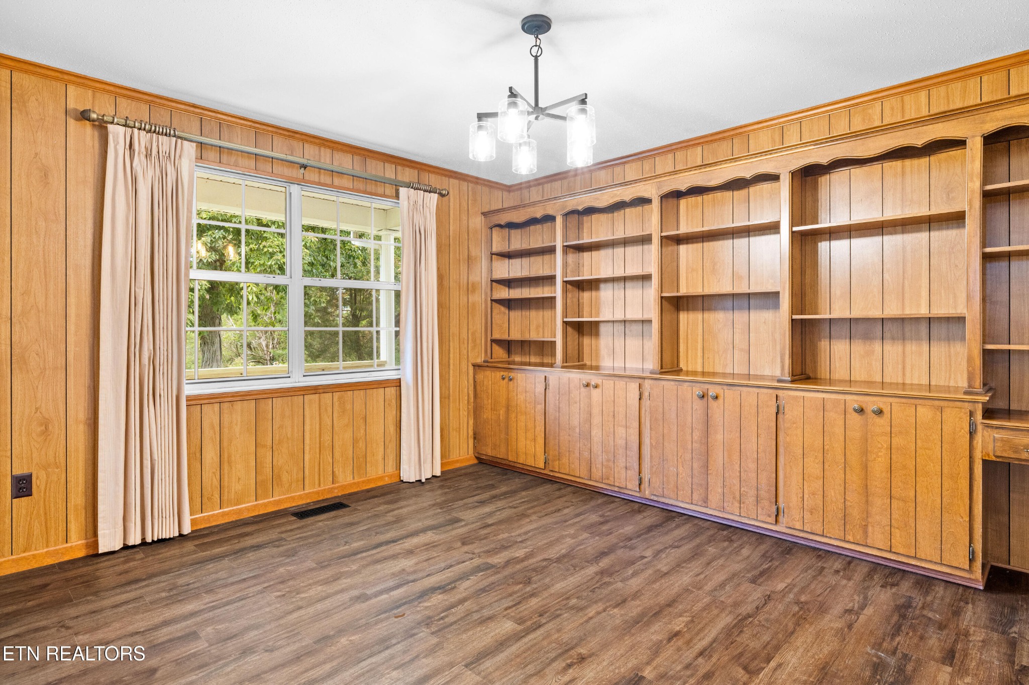 804 Chilhowee View Road Maryville, TN 37803 - Photo 8 of 38 a view of an empty room with wooden floor and windows