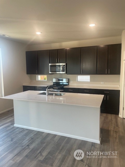 2818 Laurel Loop Milton, WA 98354 - Photo 2 of 7 a view of kitchen with stainless steel appliances granite countertop a sink and a stove top oven