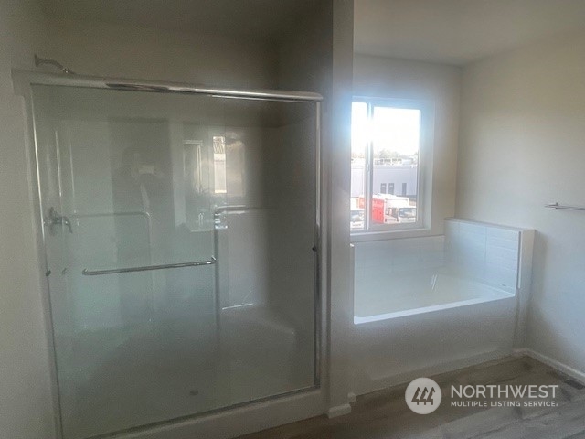 2818 Laurel Loop Milton, WA 98354 - Photo 6 of 7 a bathroom with a glass shower door